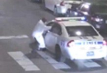 Philadelphia cop in cruiser is ambushed by gunmen